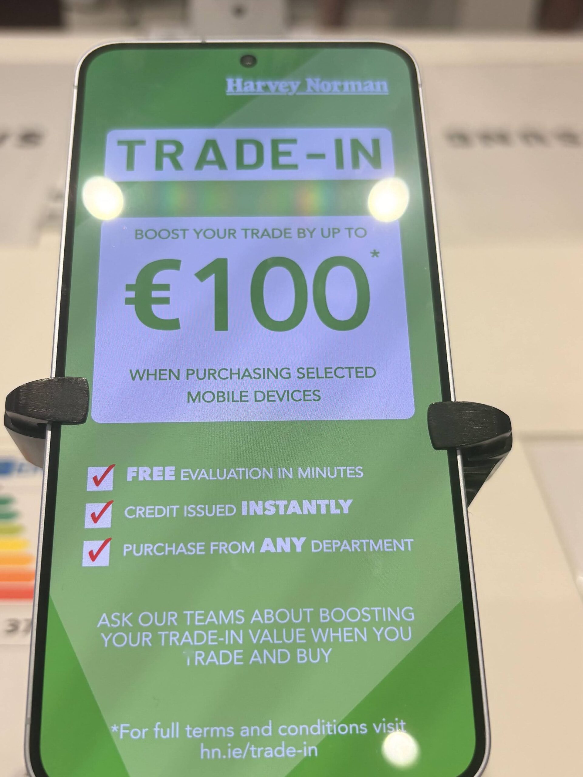 Trade in information digitally display on device at a Harvey Norman location